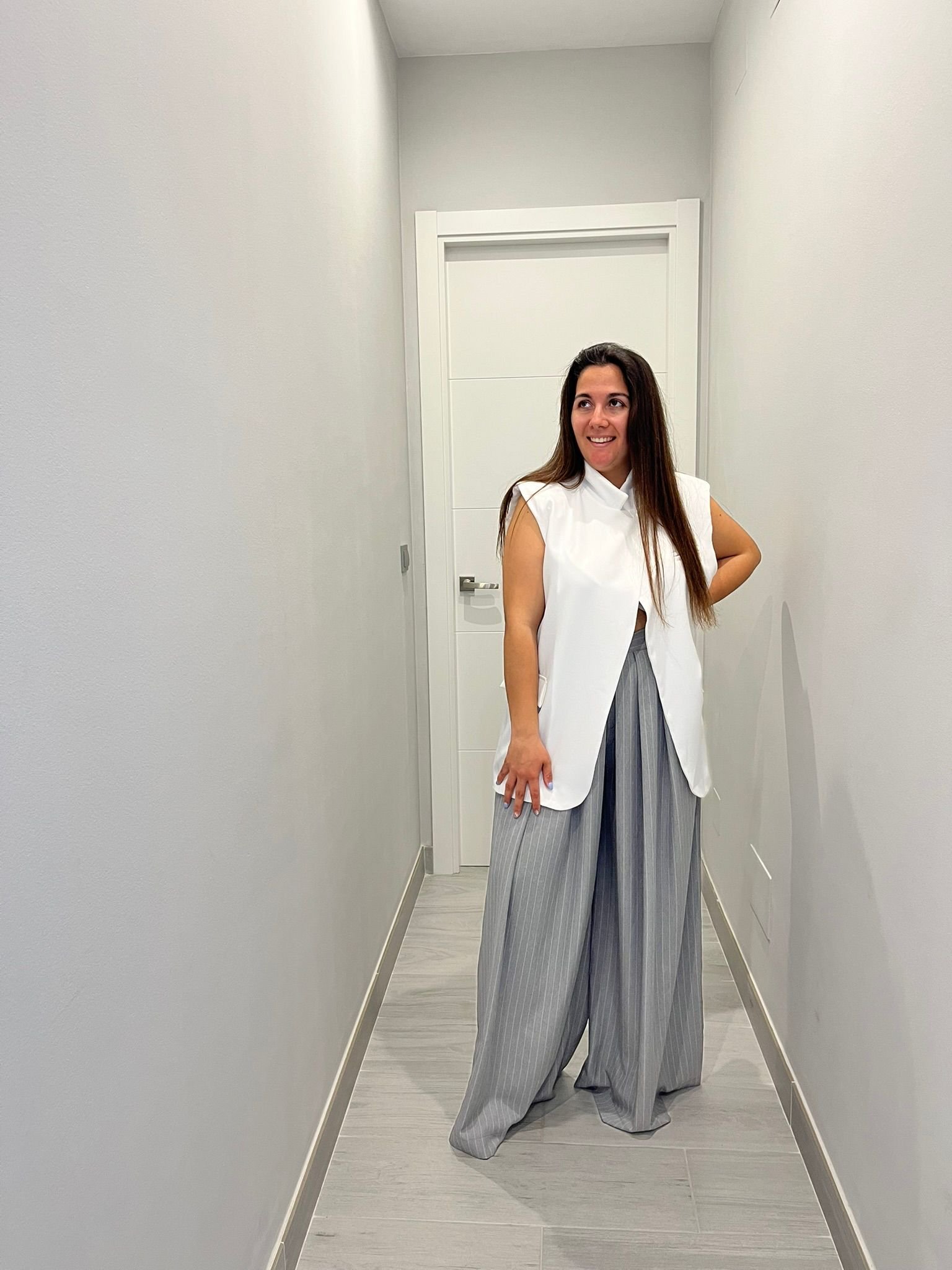 Chaleco botón blanco